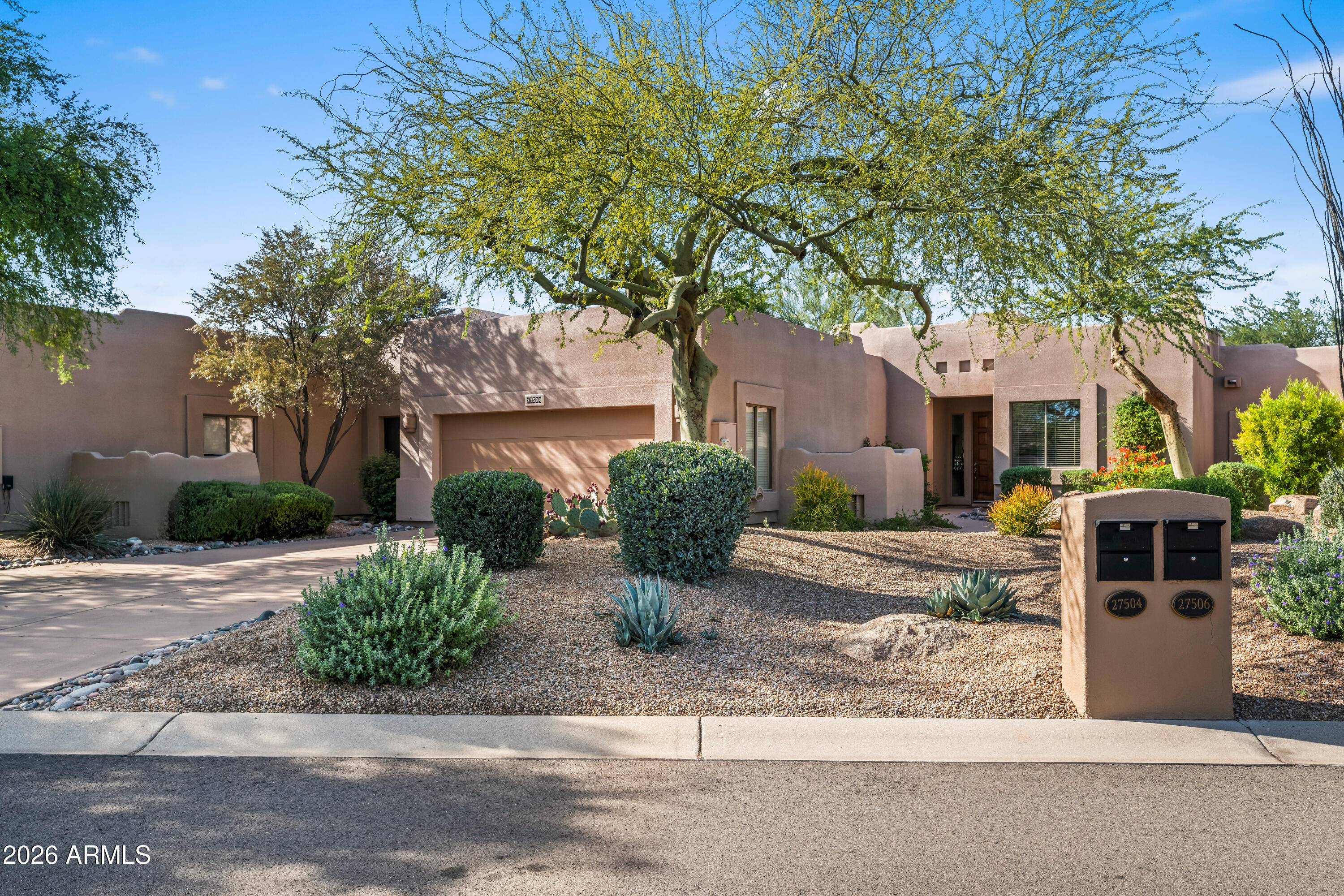 27504 North Montana Drive Rio Verde, AZ 85263 - Photo 3 of 32 a front view of a house with garden
