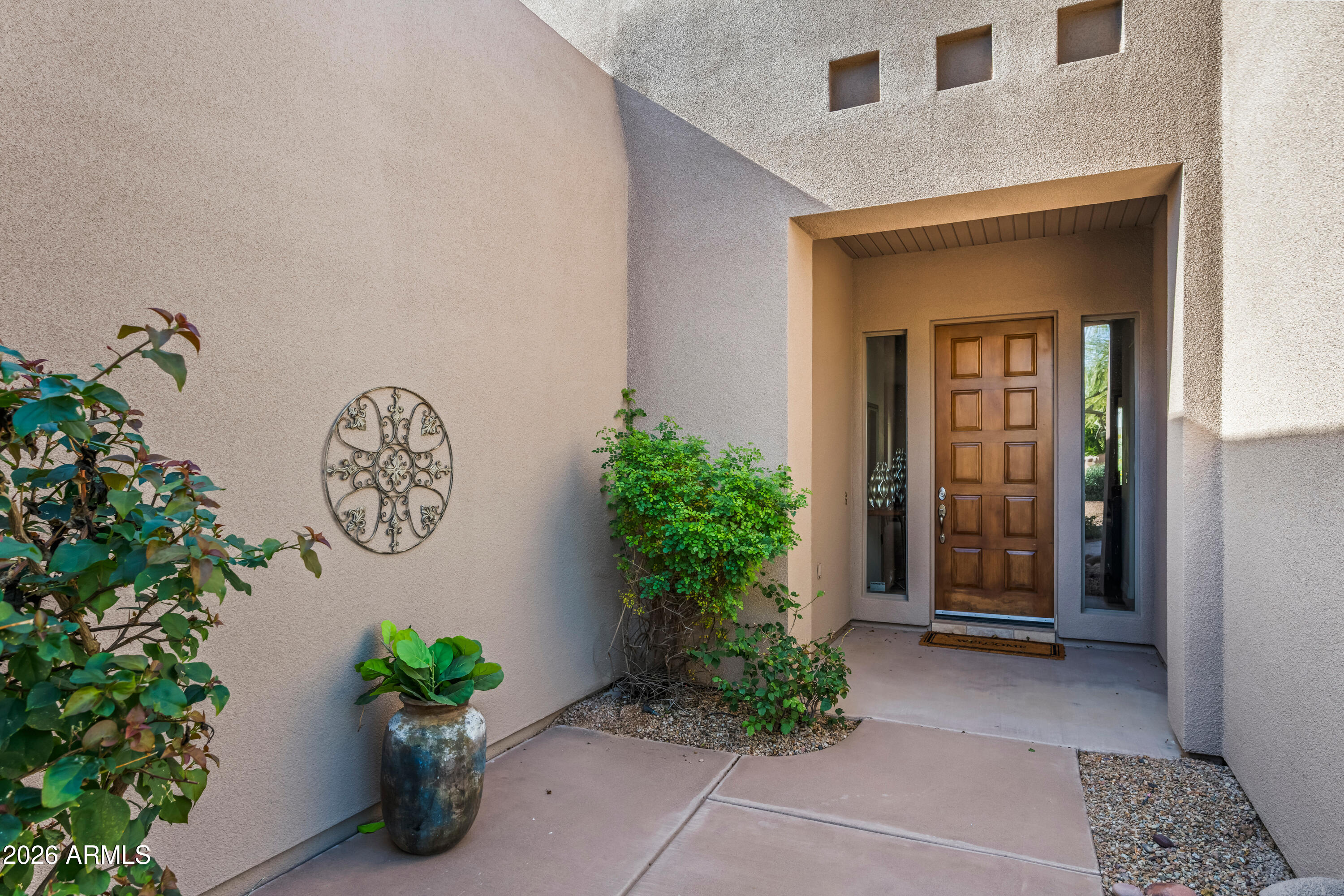 27504 North Montana Drive Rio Verde, AZ 85263 - Photo 6 of 32 a view of a entryway with flower pots
