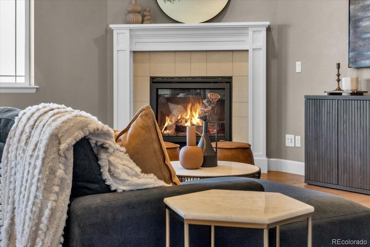 1721 Wingfeather Lane Castle Rock, CO 80108 - Photo 12 of 49 a living room with furniture and a fireplace