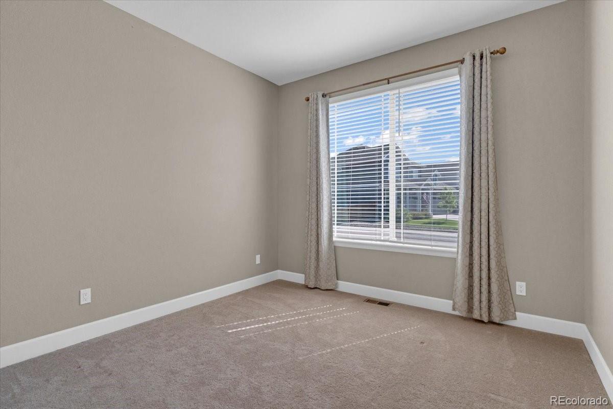 1721 Wingfeather Lane Castle Rock, CO 80108 - Photo 22 of 49 a view of an empty room with a window