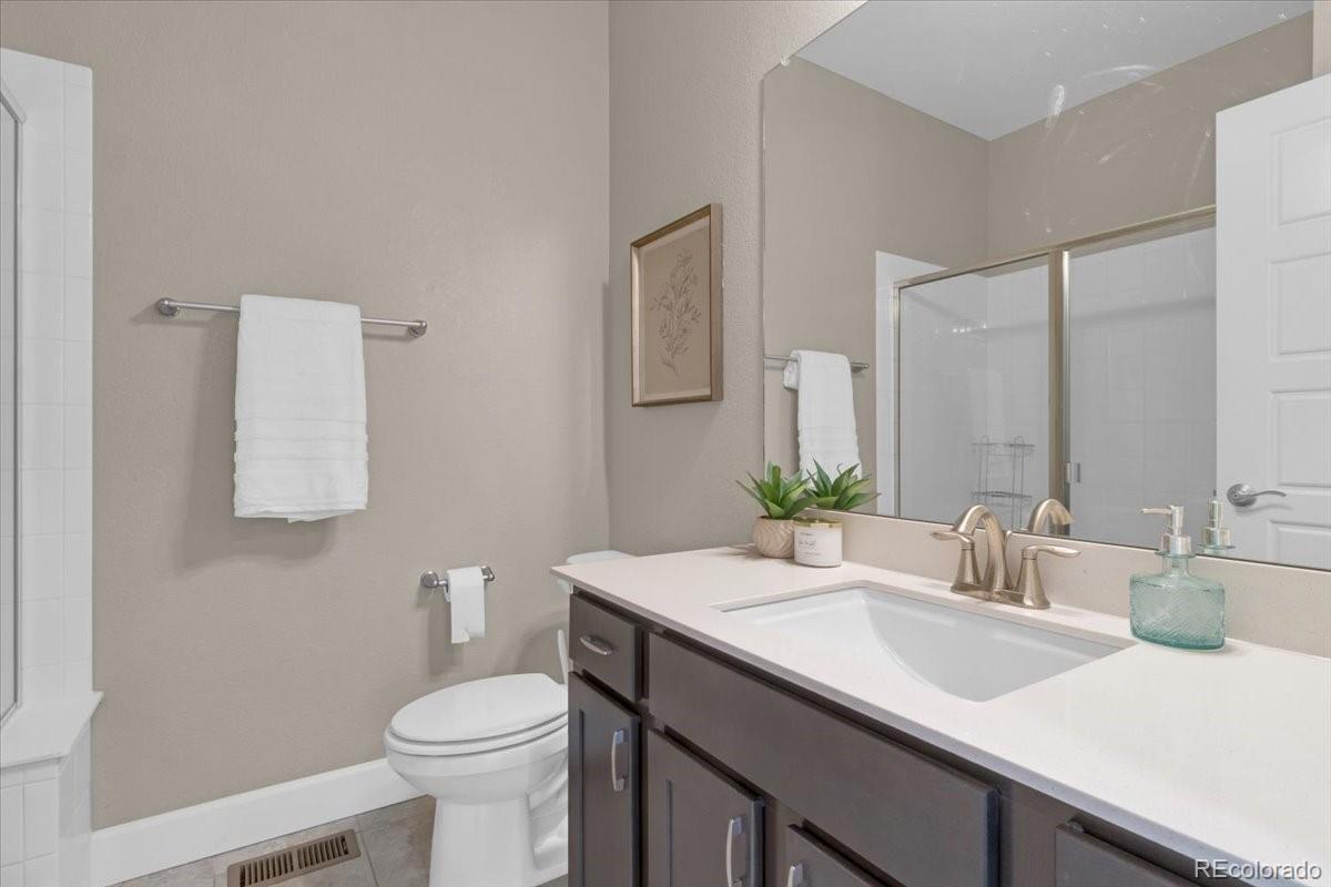 1721 Wingfeather Lane Castle Rock, CO 80108 - Photo 23 of 49 a bathroom with a sink and a toilet