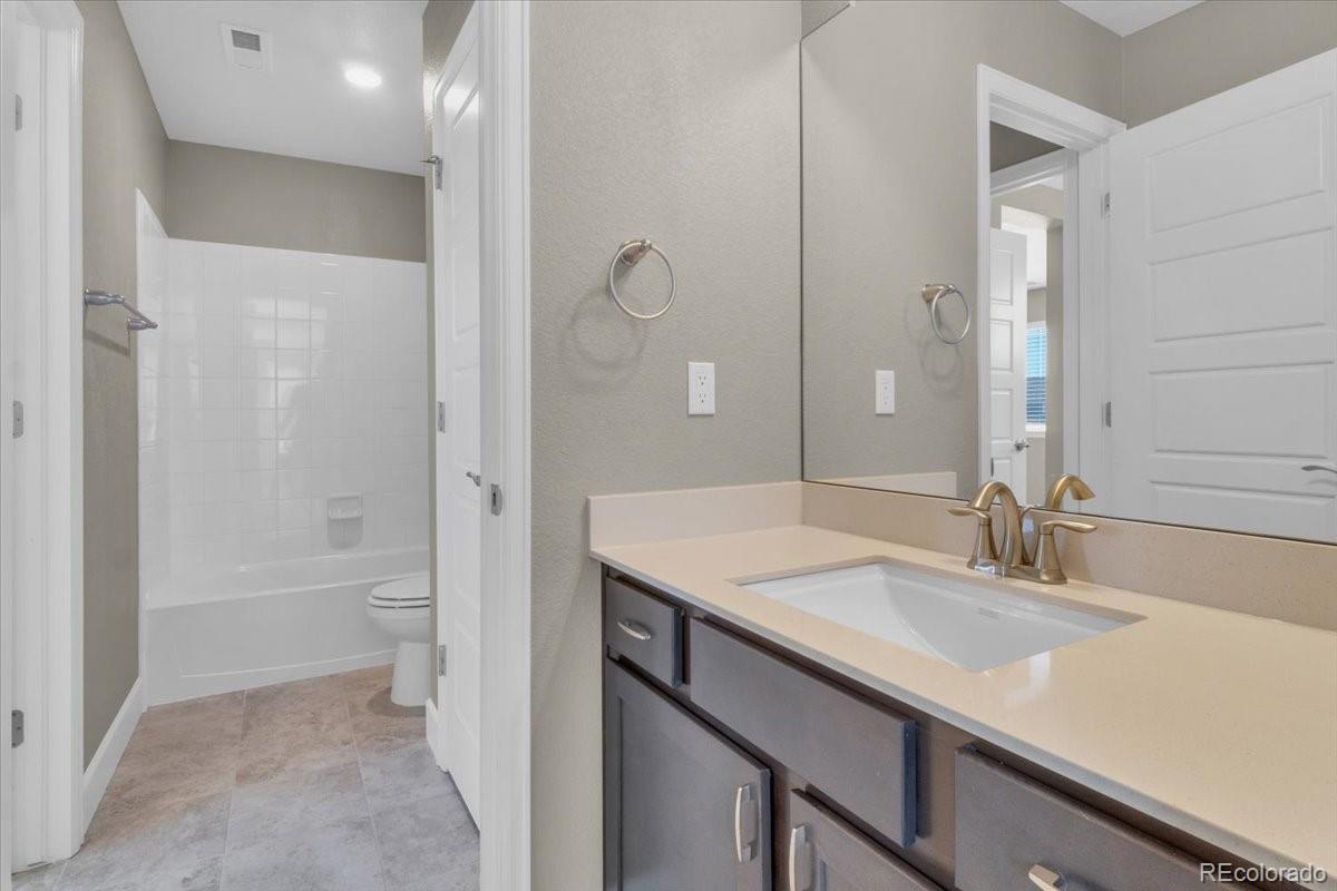 1721 Wingfeather Lane Castle Rock, CO 80108 - Photo 35 of 49 a bathroom with a sink and a mirror