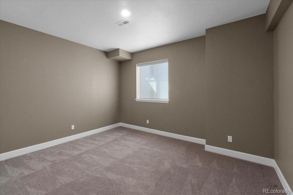 1721 Wingfeather Lane Castle Rock, CO 80108 - Photo 41 of 49 an empty room with windows
