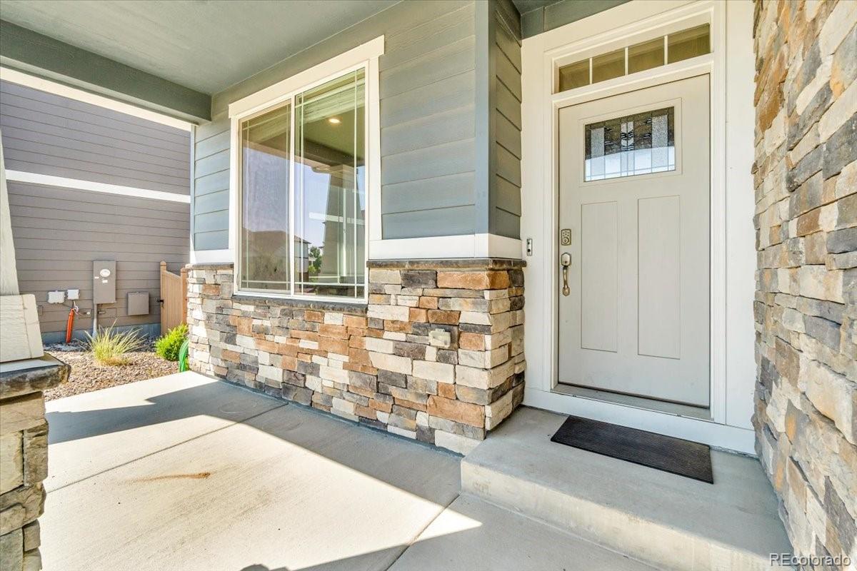 1721 Wingfeather Lane Castle Rock, CO 80108 - Photo 9 of 49 a view of front door of house with stairs