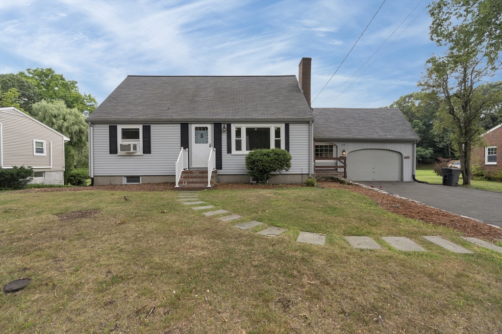 104 Mishawum Road Woburn, MA 01801 - Photo 1 of 13 a front view of a house with garden