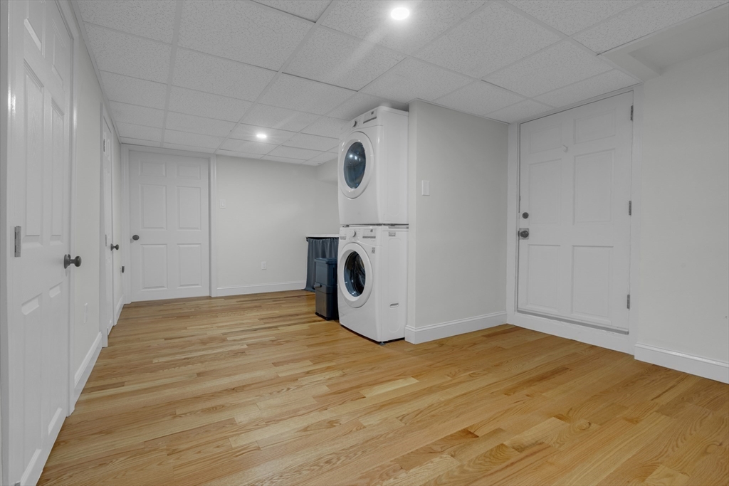 104 Mishawum Road Woburn, MA 01801 - Photo 12 of 13 a view of empty room with wooden floor and white walls