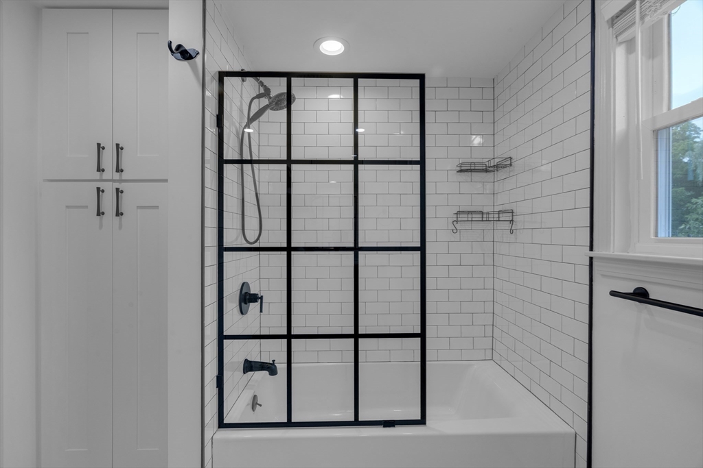 104 Mishawum Road Woburn, MA 01801 - Photo 10 of 13 a bathroom with a shower