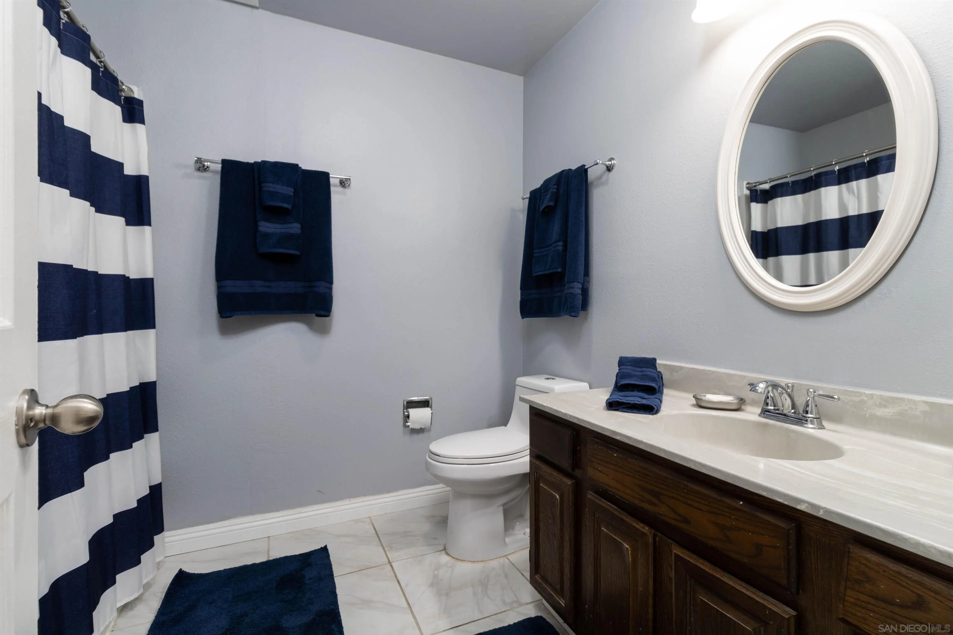 14011 Proctor Valley Road Jamul, CA 91935 - Photo 13 of 36 a bathroom with a sink and a mirror