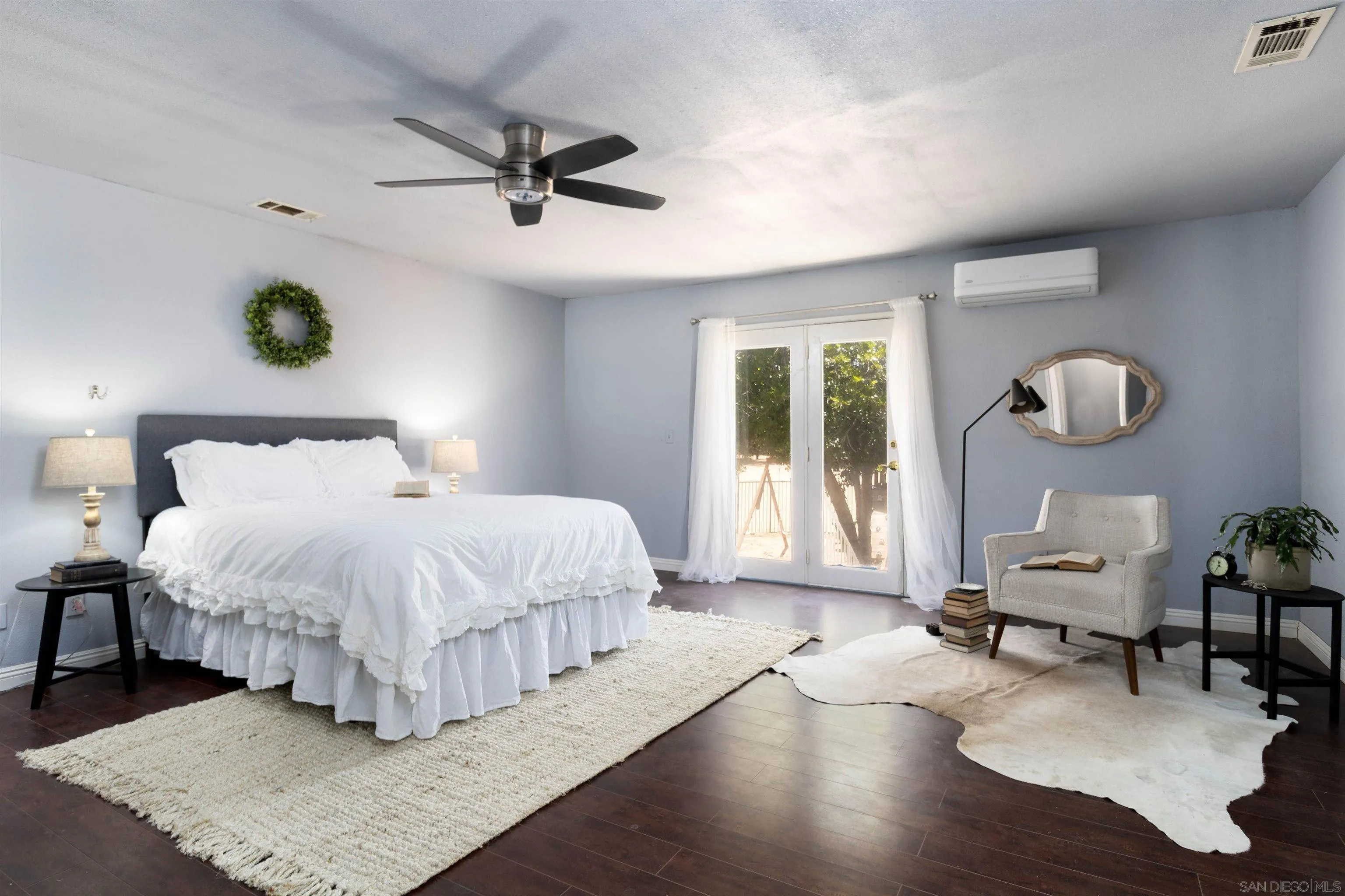 14011 Proctor Valley Road Jamul, CA 91935 - Photo 16 of 36 a bedroom with a bed mirror and a table