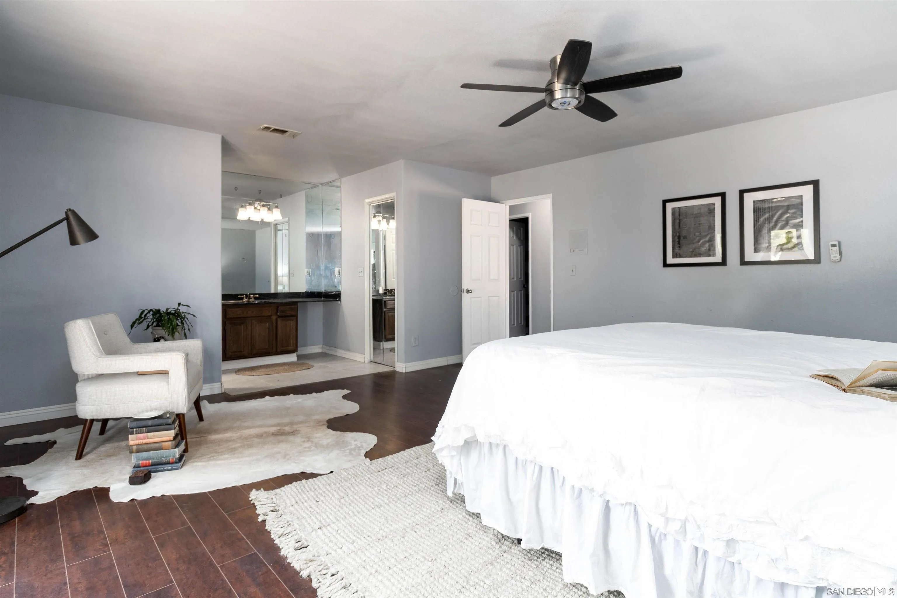 14011 Proctor Valley Road Jamul, CA 91935 - Photo 17 of 36 a bedroom with a bed and wooden floor