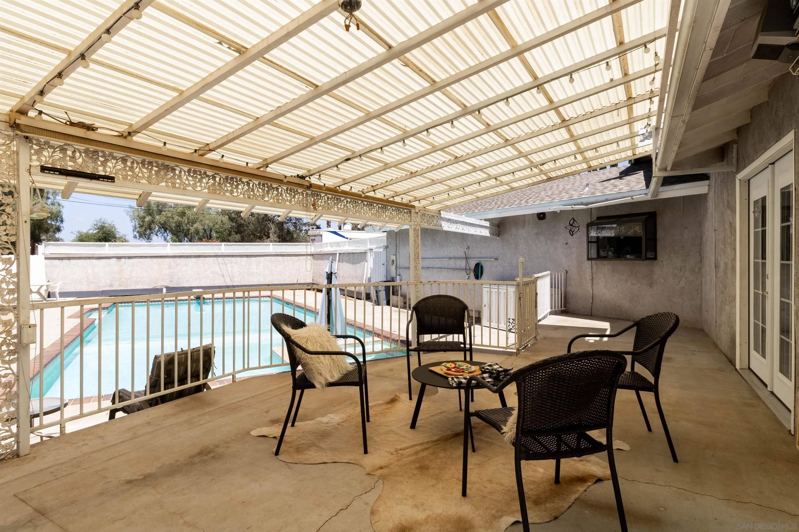 14011 Proctor Valley Road Jamul, CA 91935 - Photo 20 of 36 a view of a patio with table and chairs and potted plants