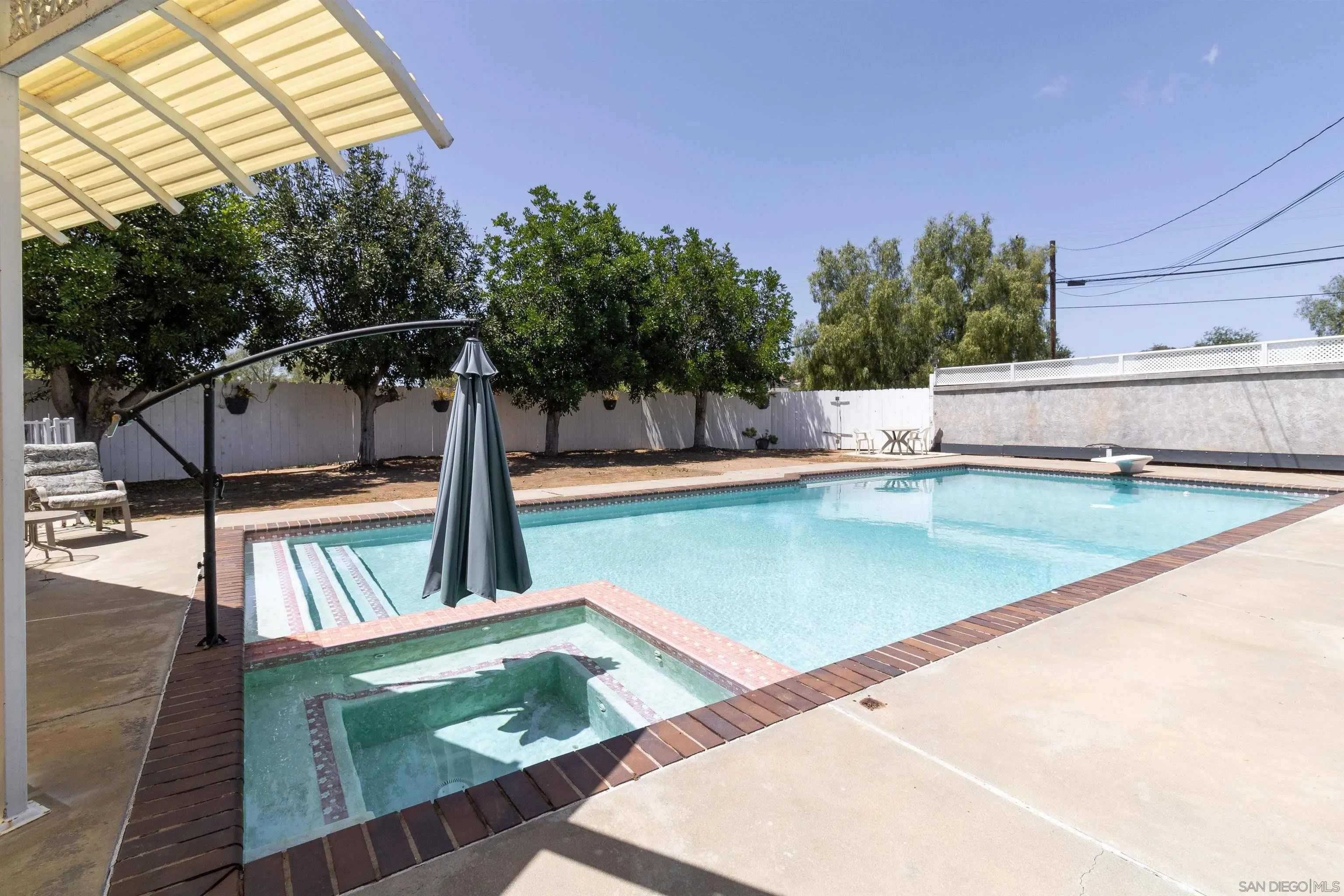 14011 Proctor Valley Road Jamul, CA 91935 - Photo 21 of 36 a view of a swimming pool with a patio
