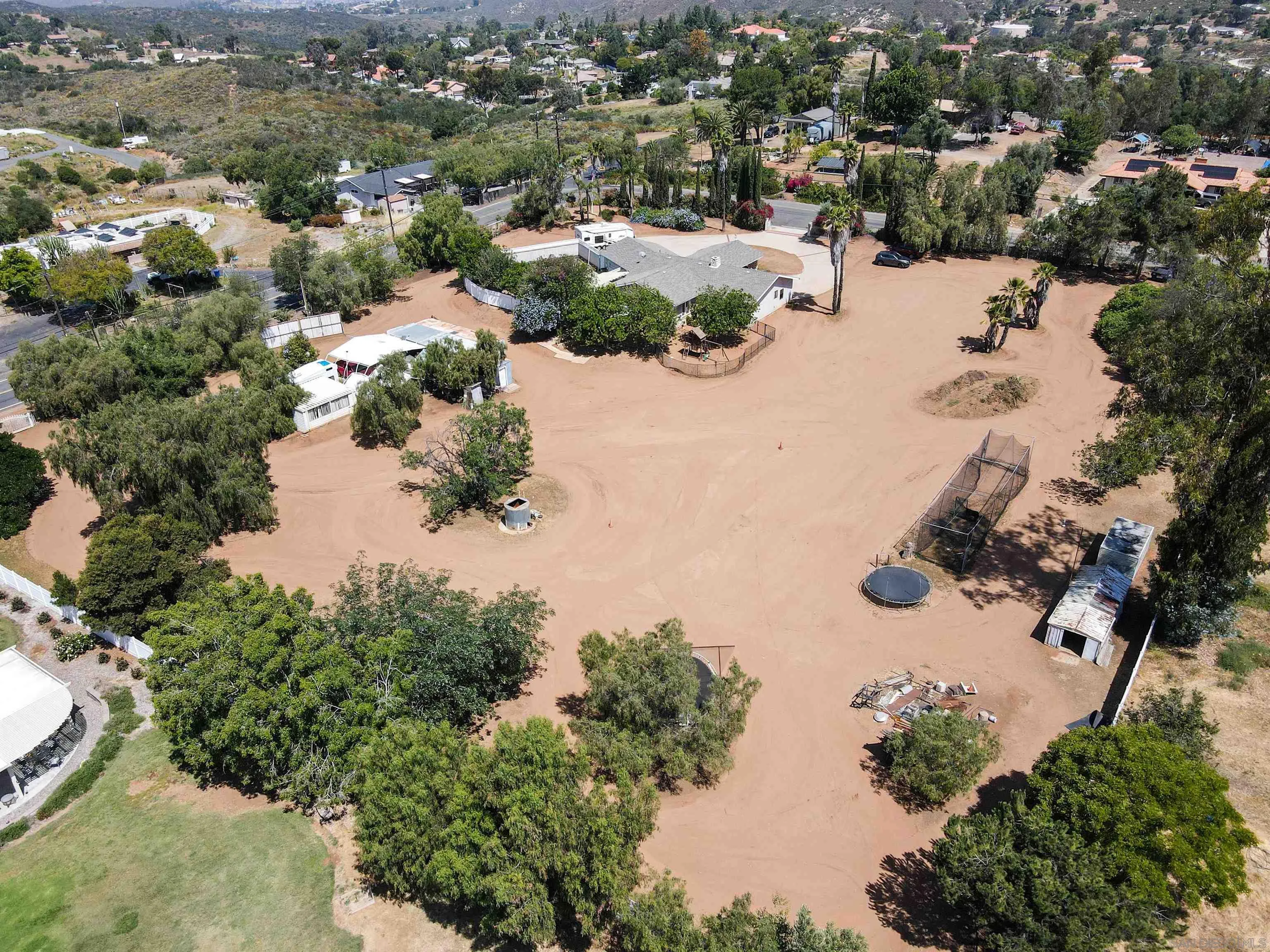 14011 Proctor Valley Road Jamul, CA 91935 - Photo 31 of 36 an aerial view of a house with yard