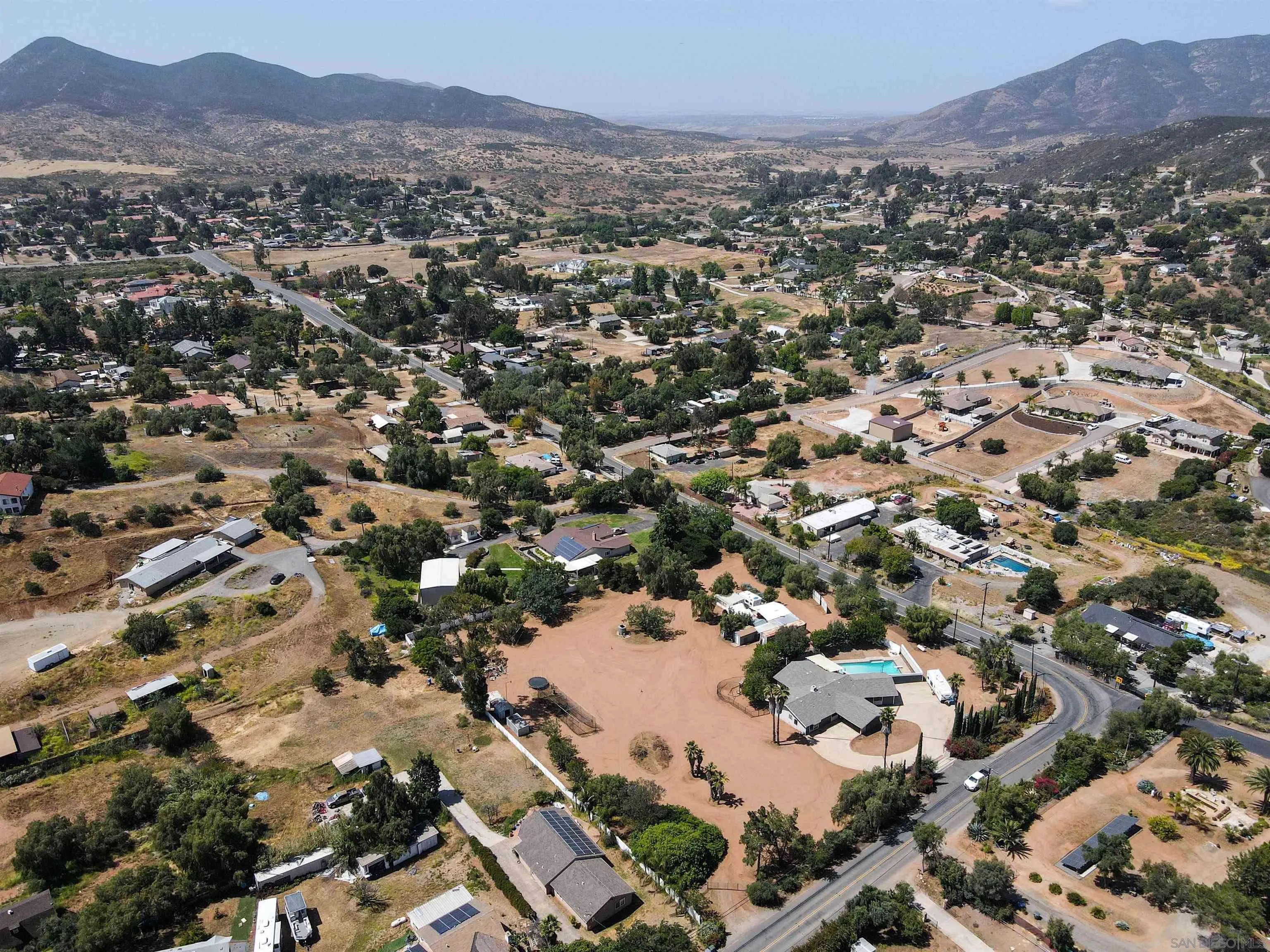 14011 Proctor Valley Road Jamul, CA 91935 - Photo 35 of 36 an aerial view of residential houses with outdoor space and trees