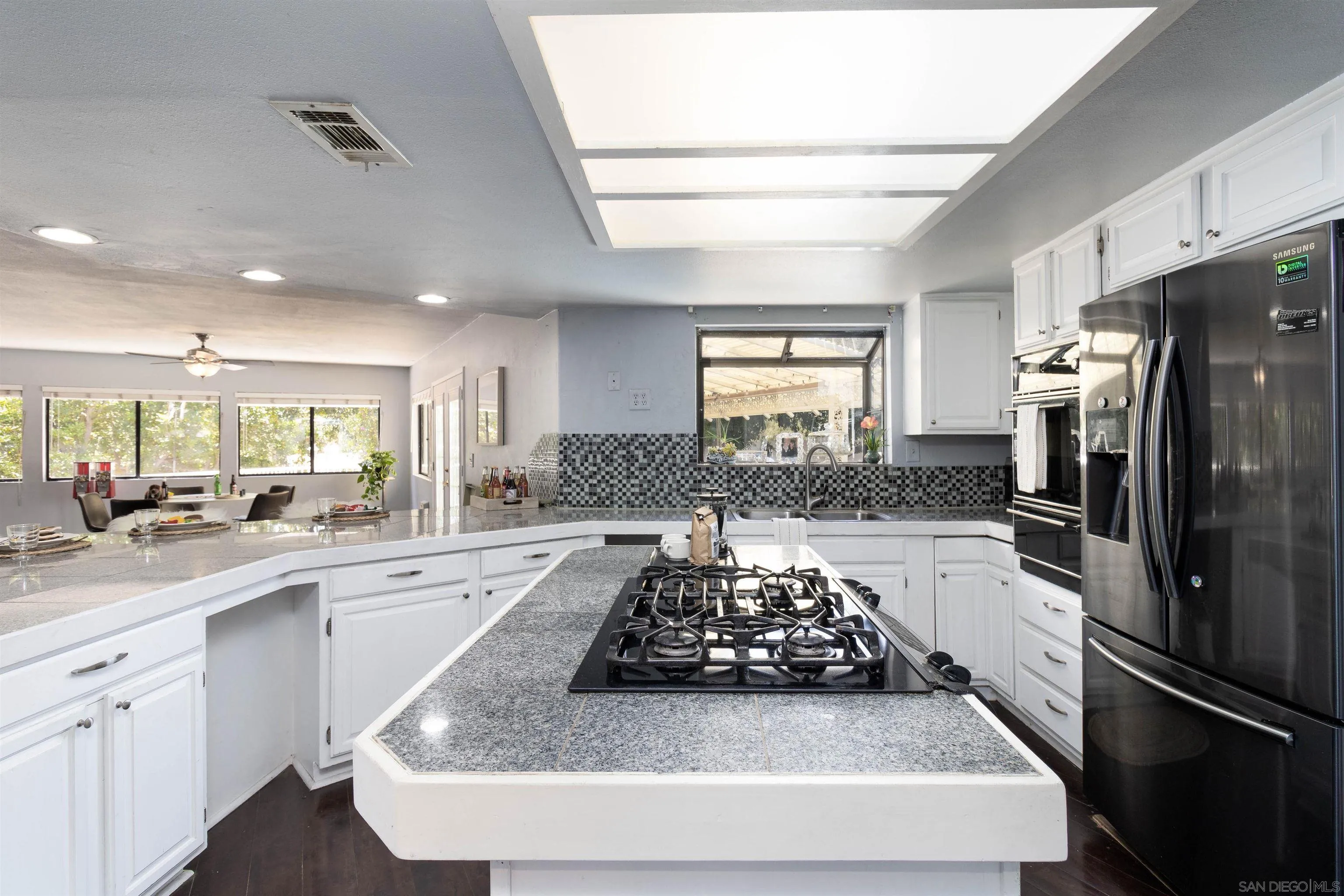 14011 Proctor Valley Road Jamul, CA 91935 - Photo 5 of 36 a kitchen with stainless steel appliances granite countertop a sink stove and refrigerator