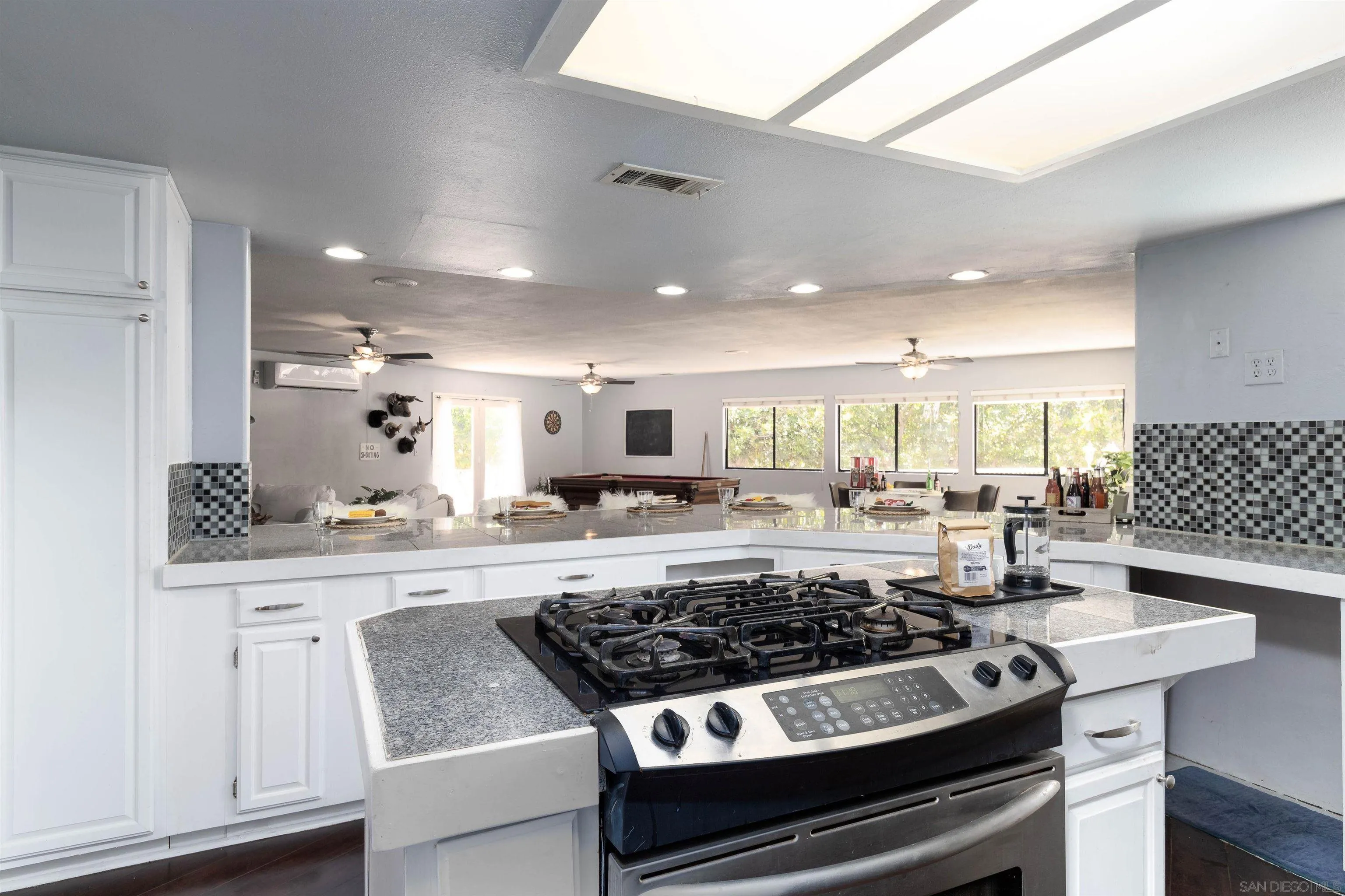 14011 Proctor Valley Road Jamul, CA 91935 - Photo 6 of 36 a kitchen with a stove and cabinets