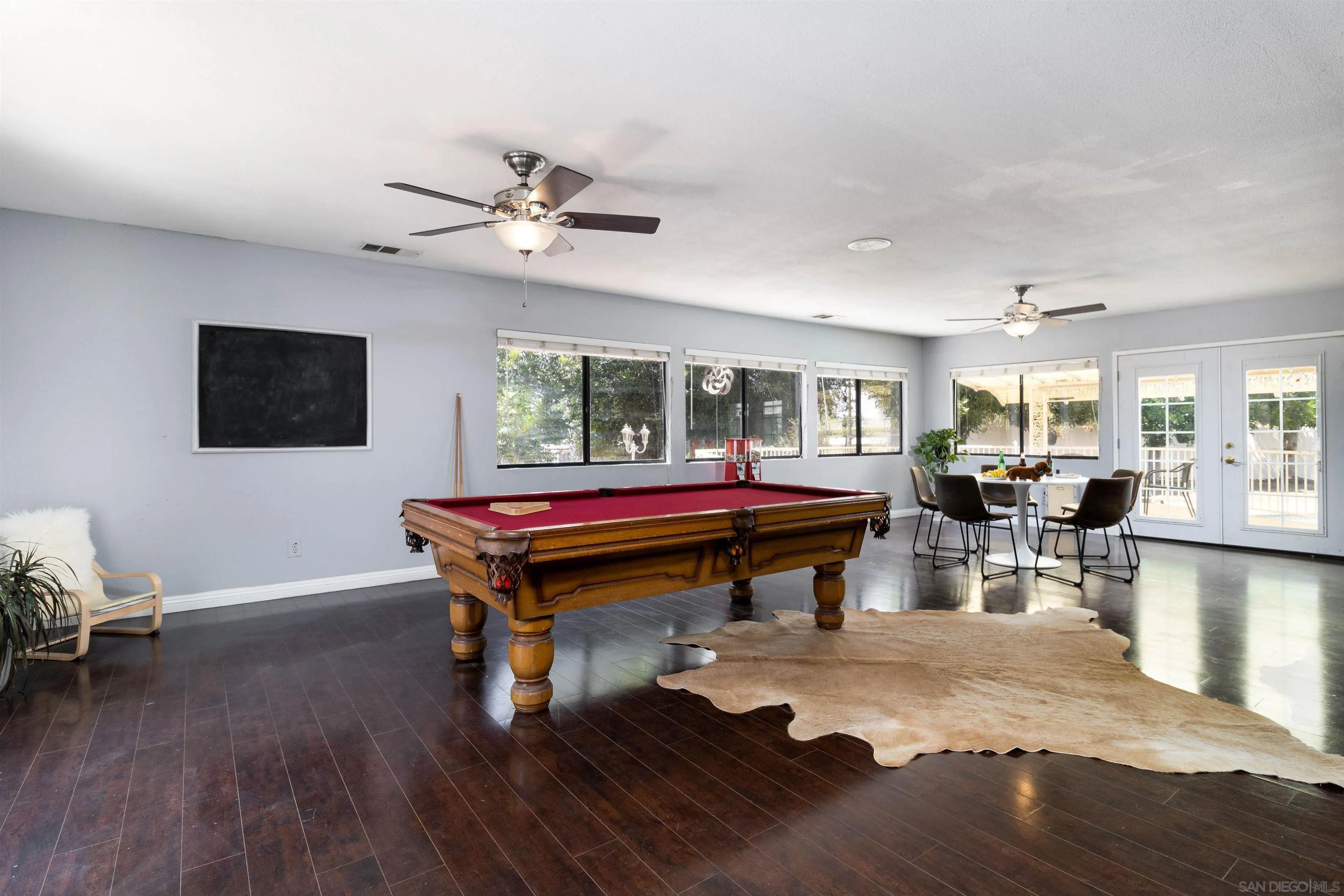 14011 Proctor Valley Road Jamul, CA 91935 - Photo 10 of 36 a living room with furniture a flat screen tv and kitchen view