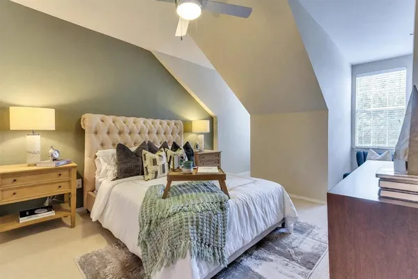 a bedroom with bed and a window