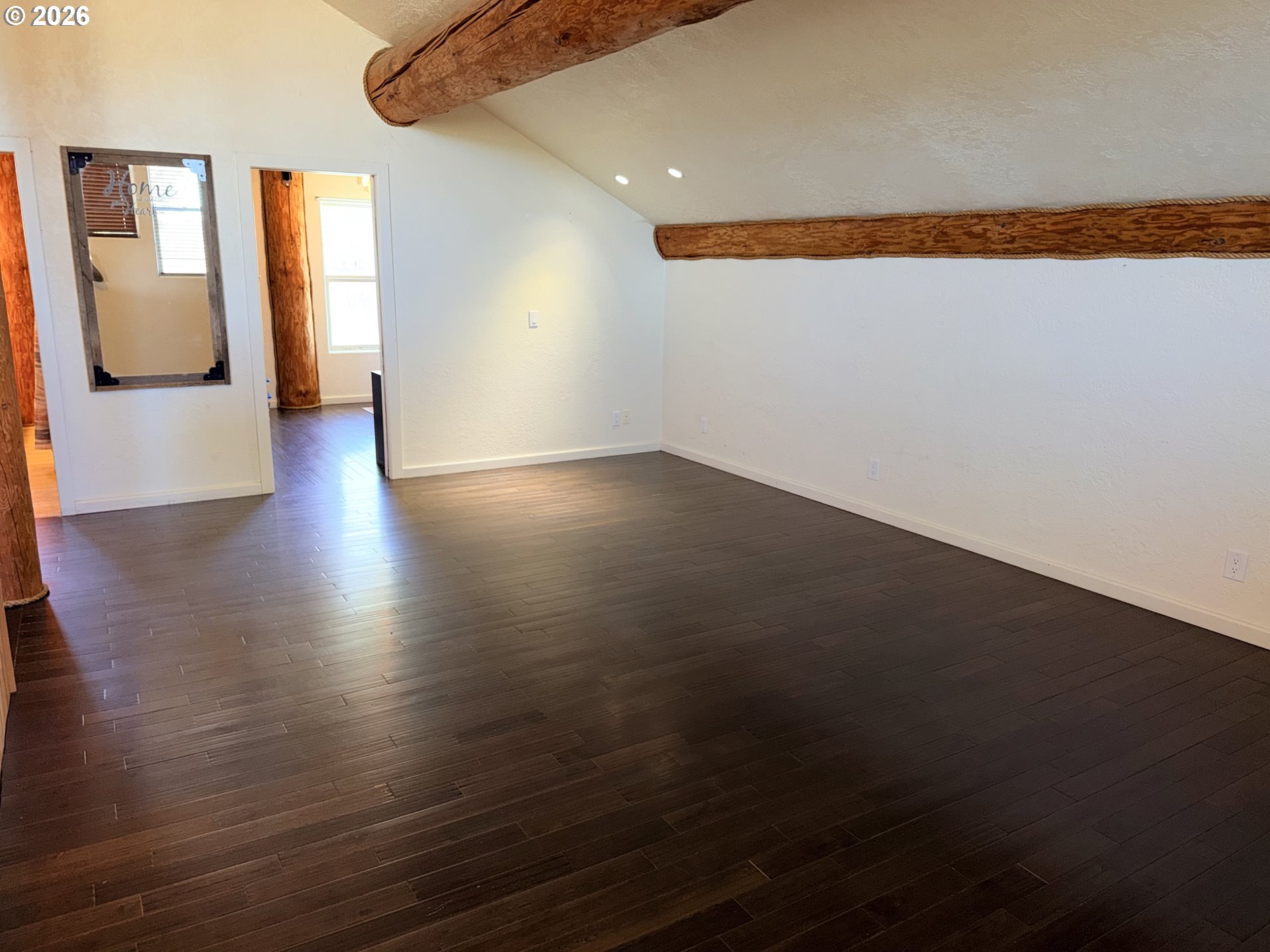92586 Water Users Lane Lakeview, OR 97630 - Photo 21 of 36 a view of an empty room with wooden floor and a window