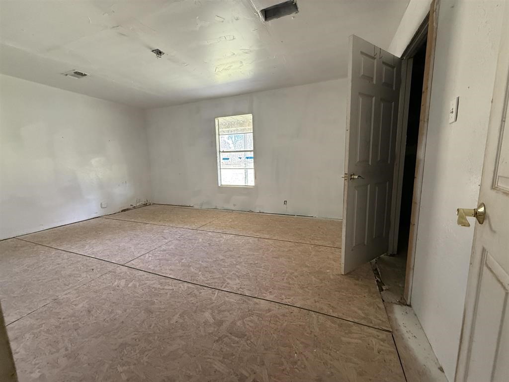 9283 Largent Road Hull, TX 77564 - Photo 12 of 22 an empty room with windows