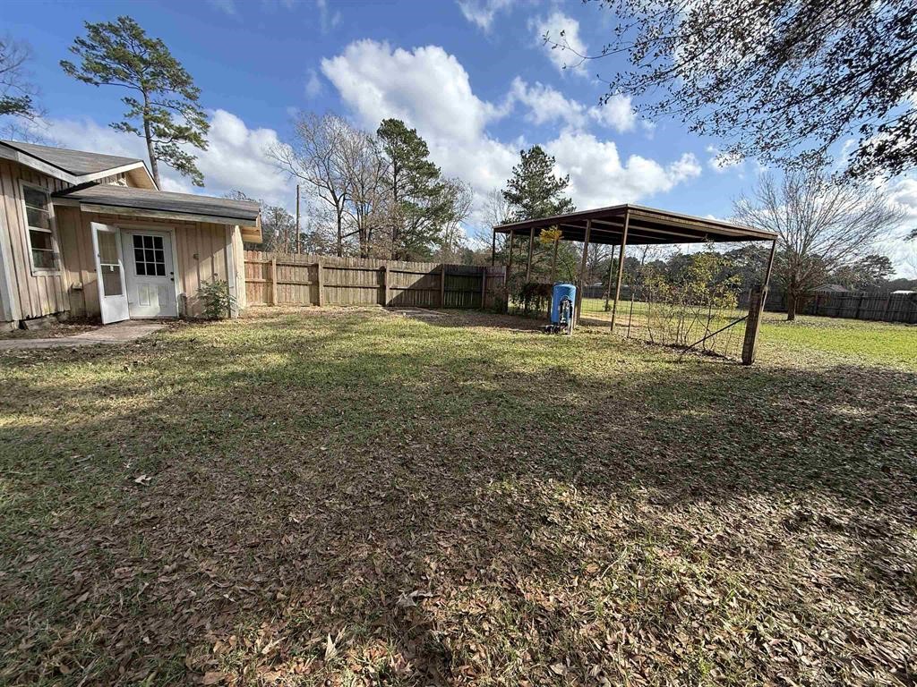 9283 Largent Road Hull, TX 77564 - Photo 19 of 22 a view of a house with a backyard