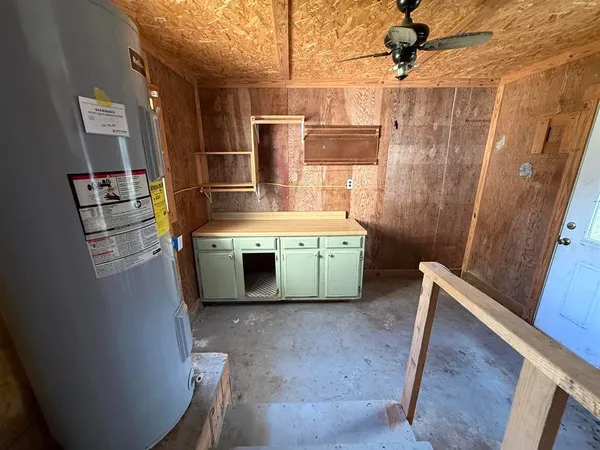 a view of an empty room with windows