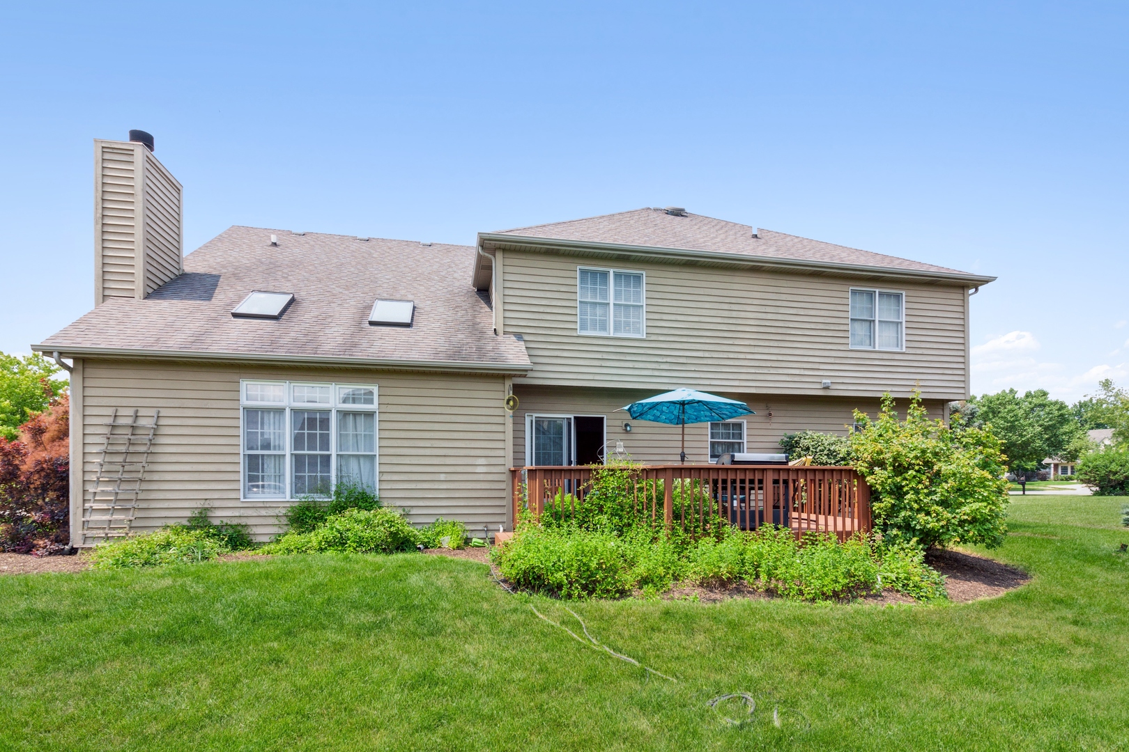 2908 Beth Lane Naperville, IL 60564 - Photo 19 of 19 a front view of a house with a yard and potted plants