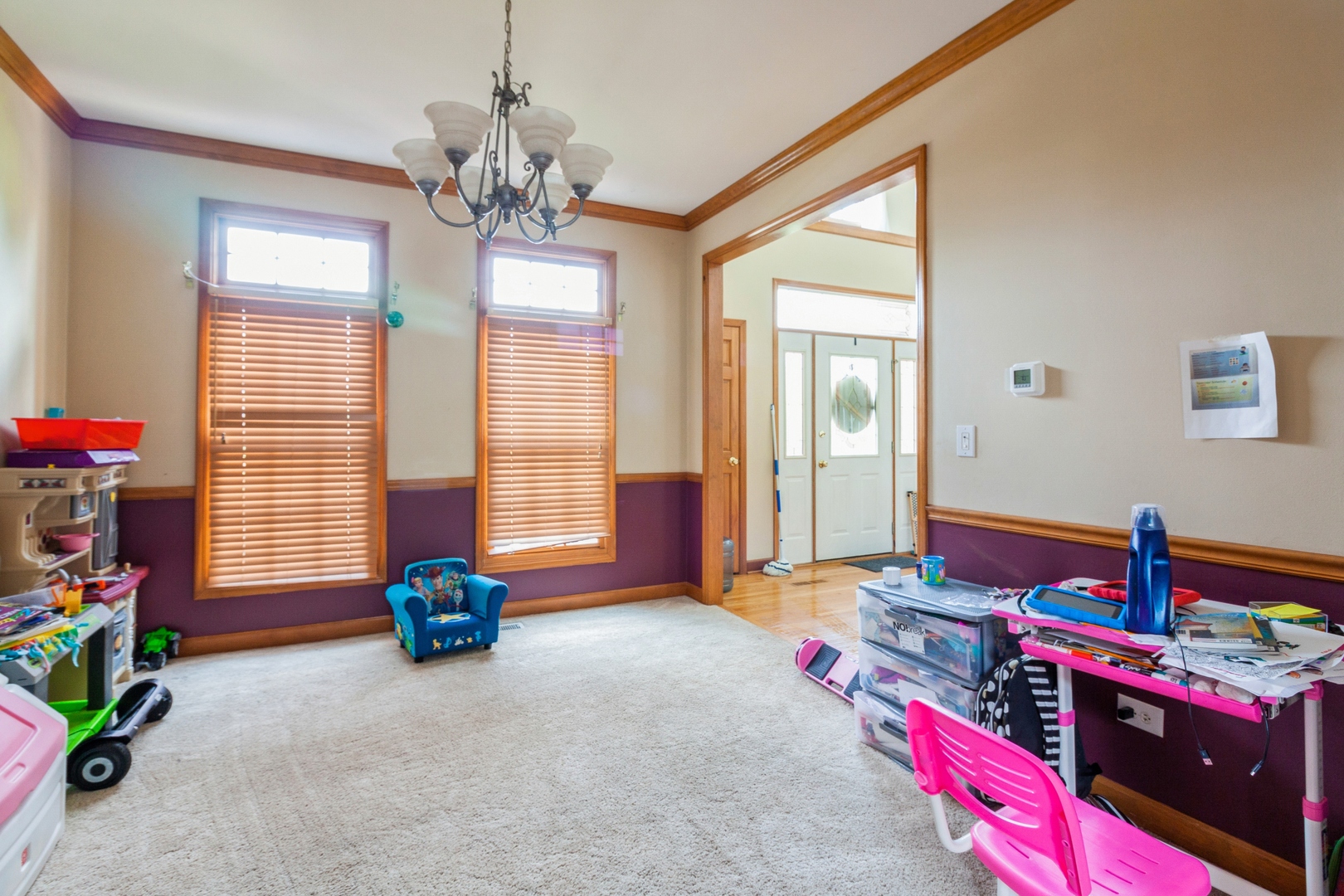 2908 Beth Lane Naperville, IL 60564 - Photo 3 of 19 a bedroom with a bed and a chandelier