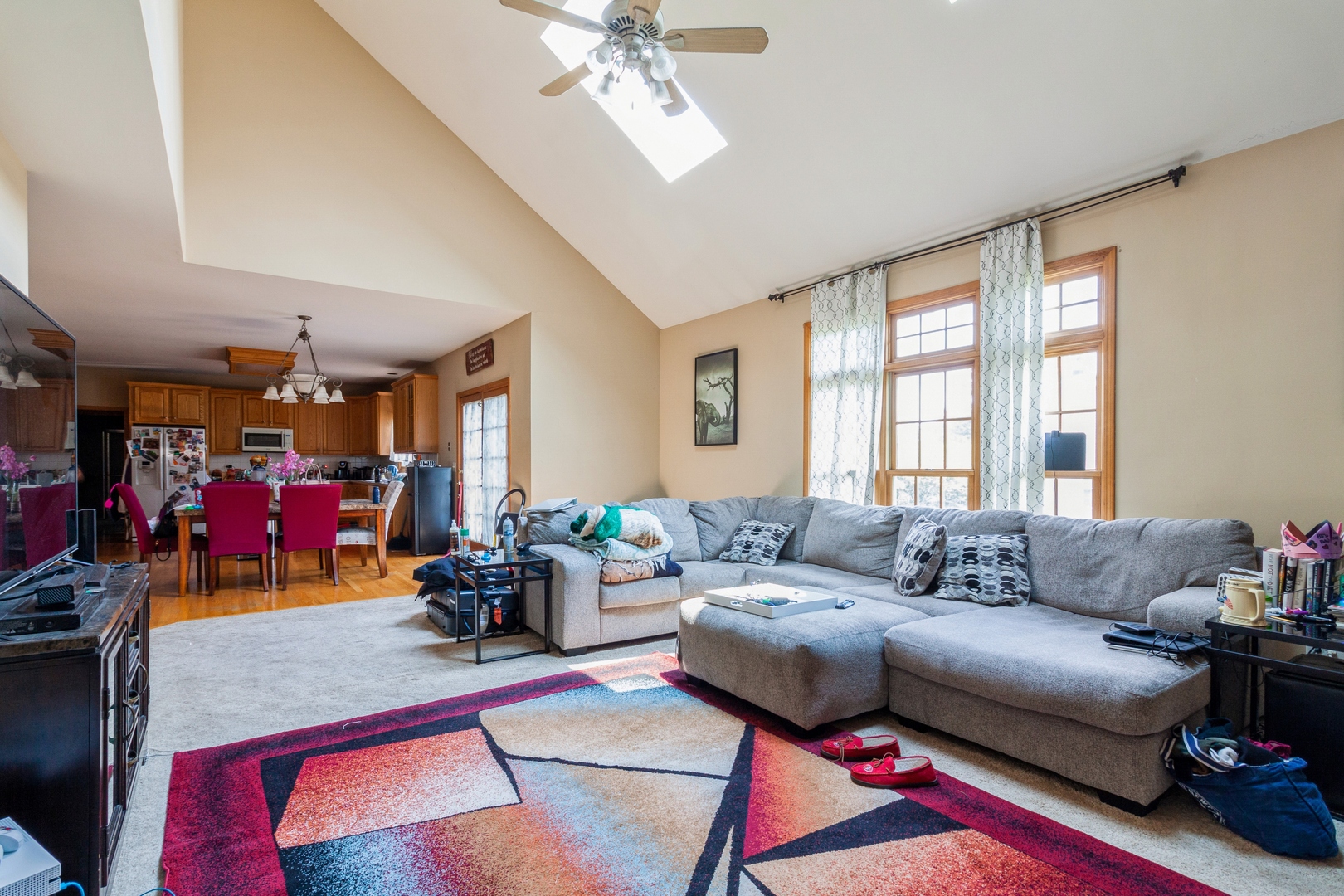 2908 Beth Lane Naperville, IL 60564 - Photo 8 of 19 a living room with furniture and a chandelier
