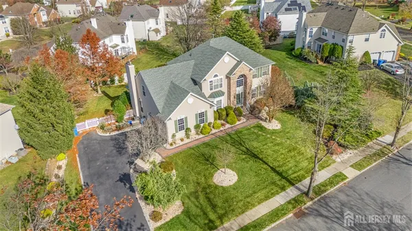 an aerial view of a houses with yard