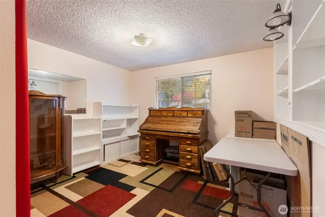 a view of a workspace with furniture