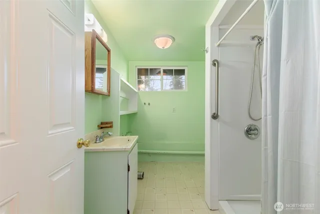 a bathroom with a sink and mirror