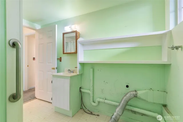 a bathroom with a sink and mirror