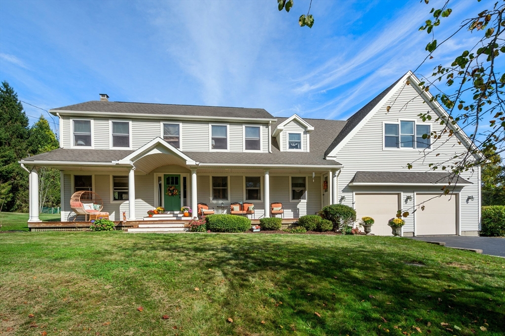 133 Dresser Hill Road Charlton, MA 01507 - Photo 1 of 42 a front view of a house with garden