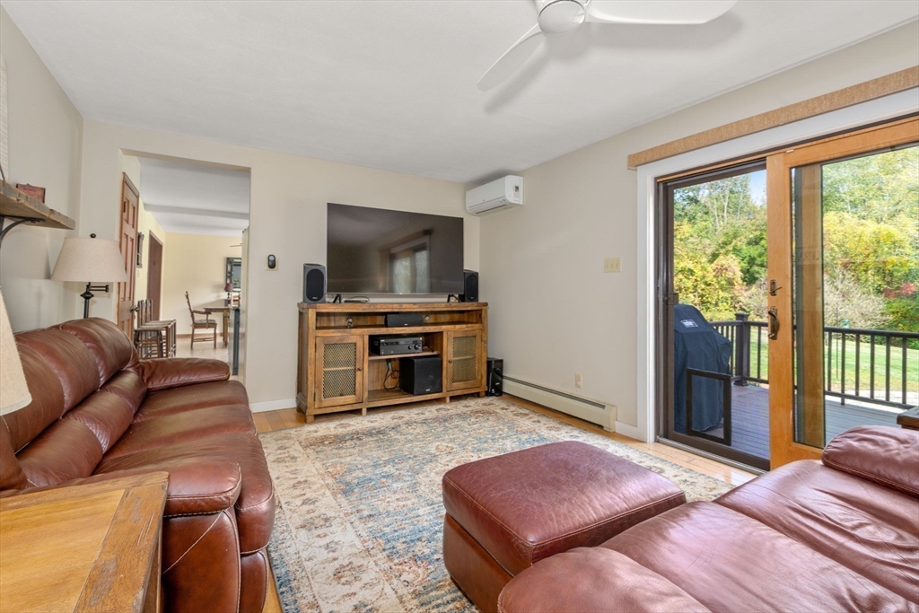 133 Dresser Hill Road Charlton, MA 01507 - Photo 11 of 42 a bedroom with a bed and a television