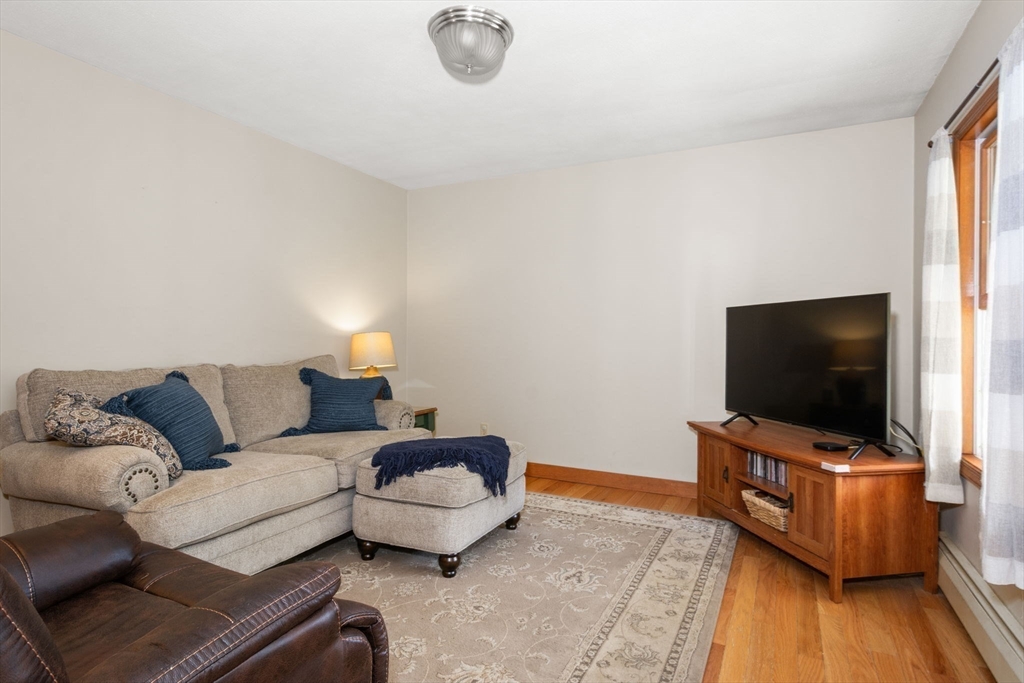 133 Dresser Hill Road Charlton, MA 01507 - Photo 14 of 42 a living room with furniture and a flat screen tv