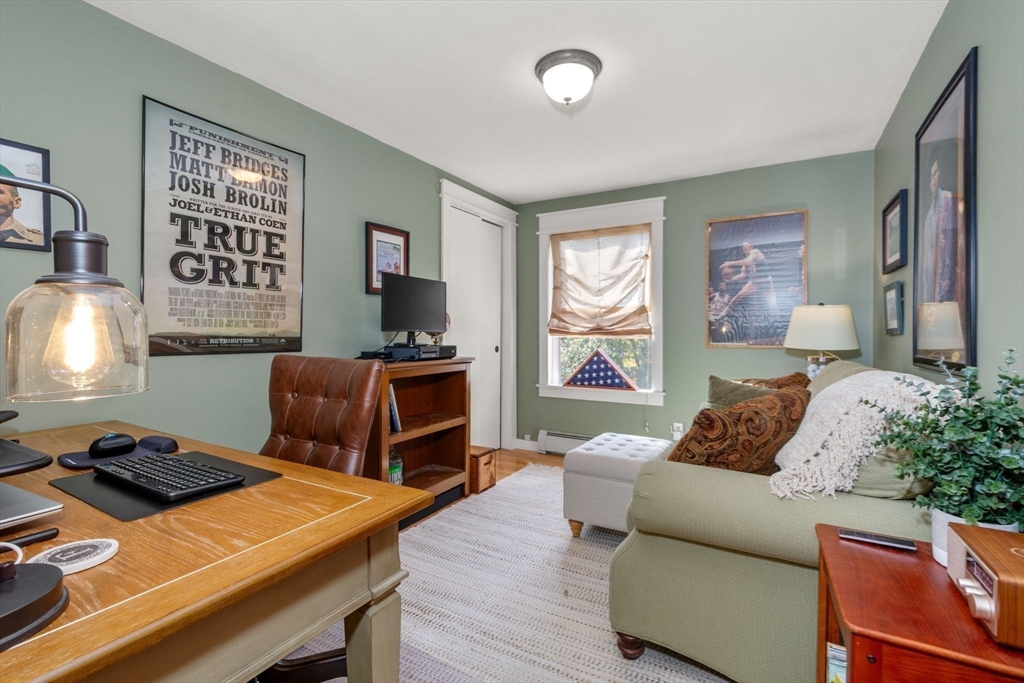 133 Dresser Hill Road Charlton, MA 01507 - Photo 16 of 42 a living room with furniture and a flat screen tv