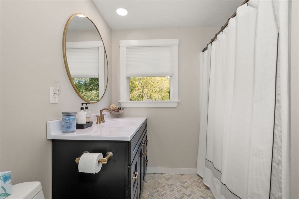 133 Dresser Hill Road Charlton, MA 01507 - Photo 24 of 42 a bathroom with a sink and a mirror