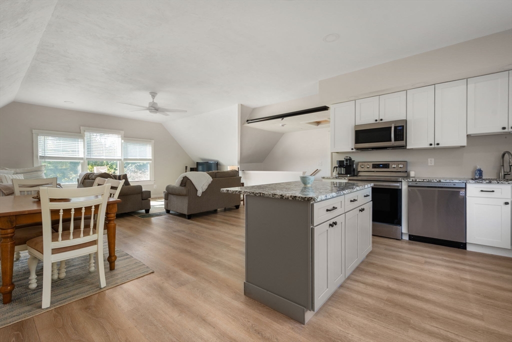 133 Dresser Hill Road Charlton, MA 01507 - Photo 25 of 42 a kitchen with granite countertop a sink and a stove top oven