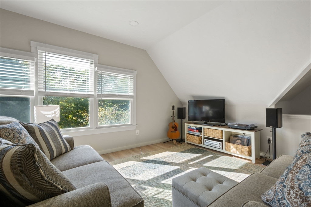133 Dresser Hill Road Charlton, MA 01507 - Photo 27 of 42 a living room with furniture and a flat screen tv
