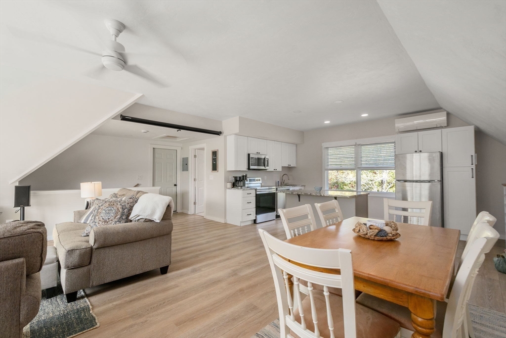 133 Dresser Hill Road Charlton, MA 01507 - Photo 29 of 42 a living room with furniture kitchen and a table