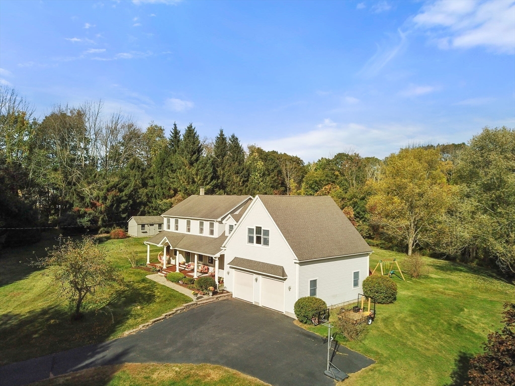 133 Dresser Hill Road Charlton, MA 01507 - Photo 38 of 42 a view of a big yard with an outdoor seating