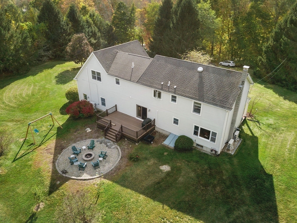 133 Dresser Hill Road Charlton, MA 01507 - Photo 39 of 42 an aerial view of a house with garden space and a patio