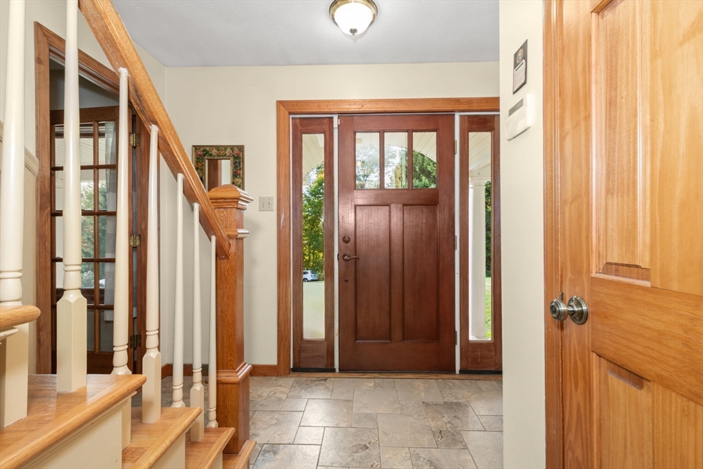 133 Dresser Hill Road Charlton, MA 01507 - Photo 4 of 42 a view of a hallway with a door and windows
