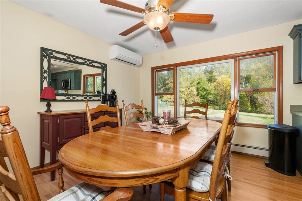 133 Dresser Hill Road Charlton, MA 01507 - Photo 7 of 42 a dining room with furniture a flat screen tv and a large window