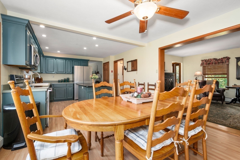 133 Dresser Hill Road Charlton, MA 01507 - Photo 8 of 42 a dining room with a table chairs and a kitchen view