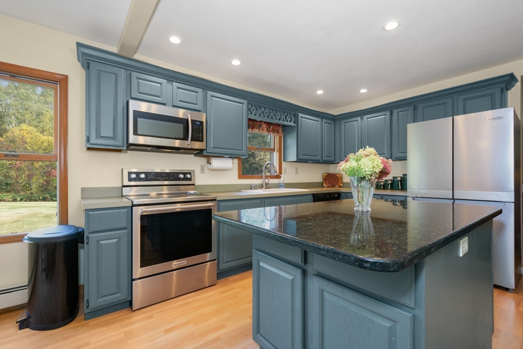 133 Dresser Hill Road Charlton, MA 01507 - Photo 9 of 42 a kitchen with stainless steel appliances granite countertop a sink a stove and a refrigerator