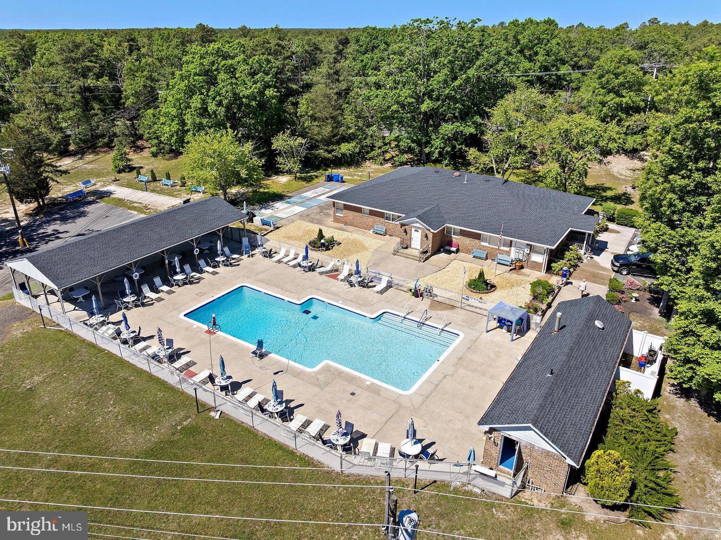 55 Sycamore Access Road Manahawkin, NJ 08050 - Photo 24 of 45 Serene poolside retreat in nature.