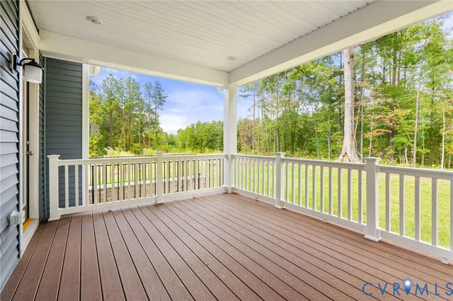 a view of a balcony with wooden floor