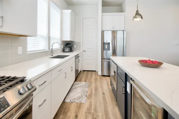 a view of a livingroom with furniture and a flat screen tv